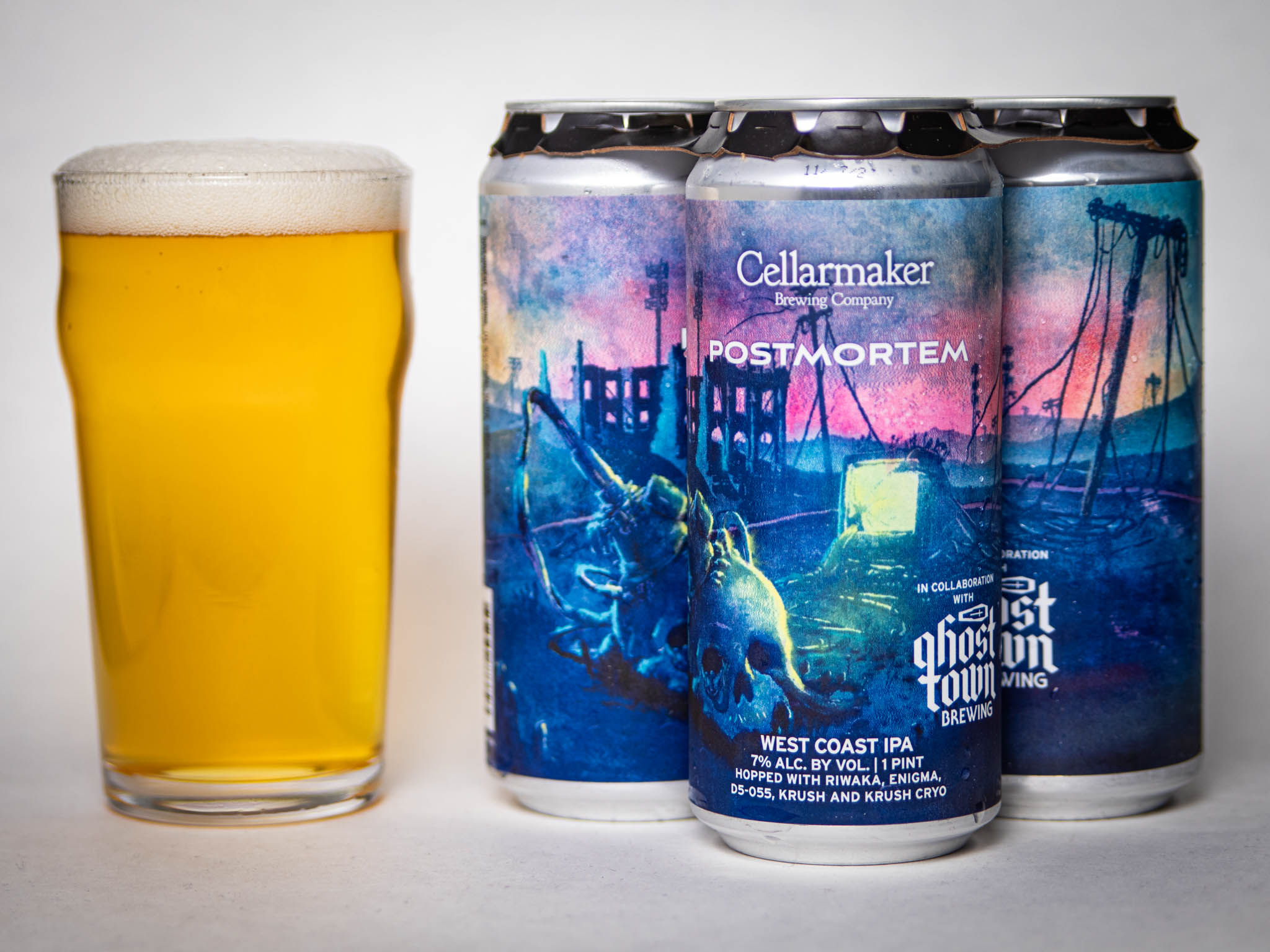 A Glass Of Hazy Yellow Beer Sits Next To Three Cans Labeled &Amp;Quot;Post Mortem&Amp;Quot; By Cellarmaker And Ghost Town Brewing, Featuring Dark, Moody Art Of Ruins And Industrial Scenes.