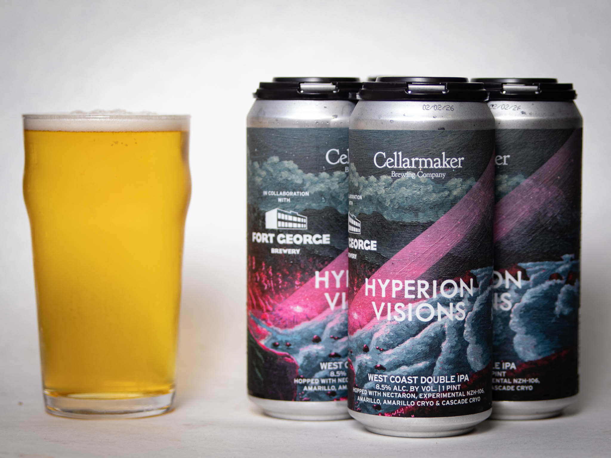 A Pint Glass Filled With Hazy Beer Stands Next To Four Cans Labeled “Hyperion Visions” West Coast Double Ipa From Fort George Brewery And Cellarmaker With Colorful, Space-Themed Artwork.