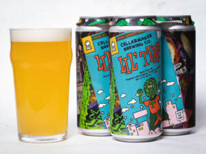 A pint glass of hazy, pale yellow beer sits beside three colorful cans of Lil Terp - Hazy Pale Ale from Cellarmaker Brewing Co., each featuring a cartoon hop character on the label.