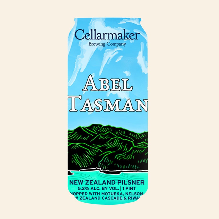 A Can Of Cellarmaker Brewing Company’s Abel Tasman New Zealand Pilsner With A Blue Sky, Green Mountains, And Beer Details On The Label.