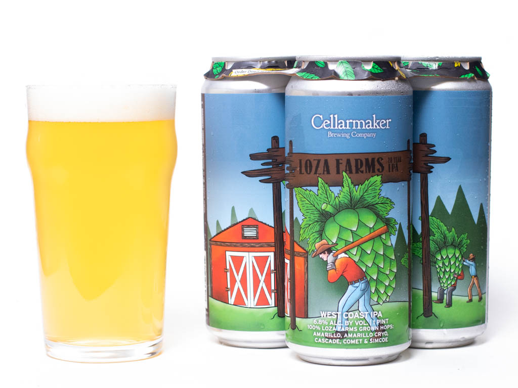 A Glass Of Hazy Yellow Beer Sits Next To Four Cans Of Cellarmaker Loza Farms Ipa, Featuring Colorful Labels With A Barn, Trees, And People Harvesting Large Hops.