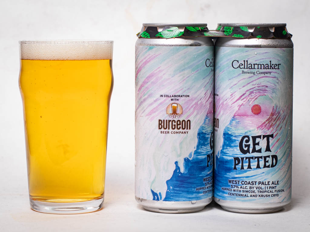 A Pint Glass Of Pale Yellow Beer Sits Next To Two Colorful Cans Labeled “Get Pitted,” A West Coast Pale Ale Collaboration From Burgeon Beer Company And Cellarmaker Brewing Company.
